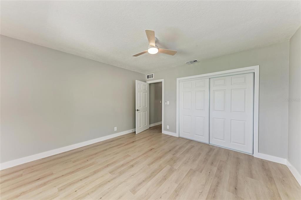 893 North Shore Drive Anna Maria, FL 34216 - Photo 27 of 62 wooden floor in an empty room