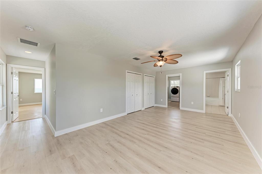 893 North Shore Drive Anna Maria, FL 34216 - Photo 33 of 62 wooden floor in an empty room with a window