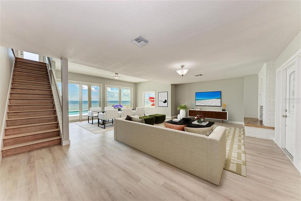 893 North Shore Drive Anna Maria, FL 34216 - Photo 9 of 62 a living room with furniture and a wooden floor