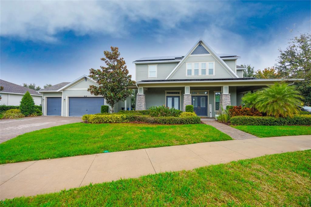 14006 Quarry Lake Road Lithia, FL 33547 - Photo 27 of 50 a front view of a house with a yard and potted plants