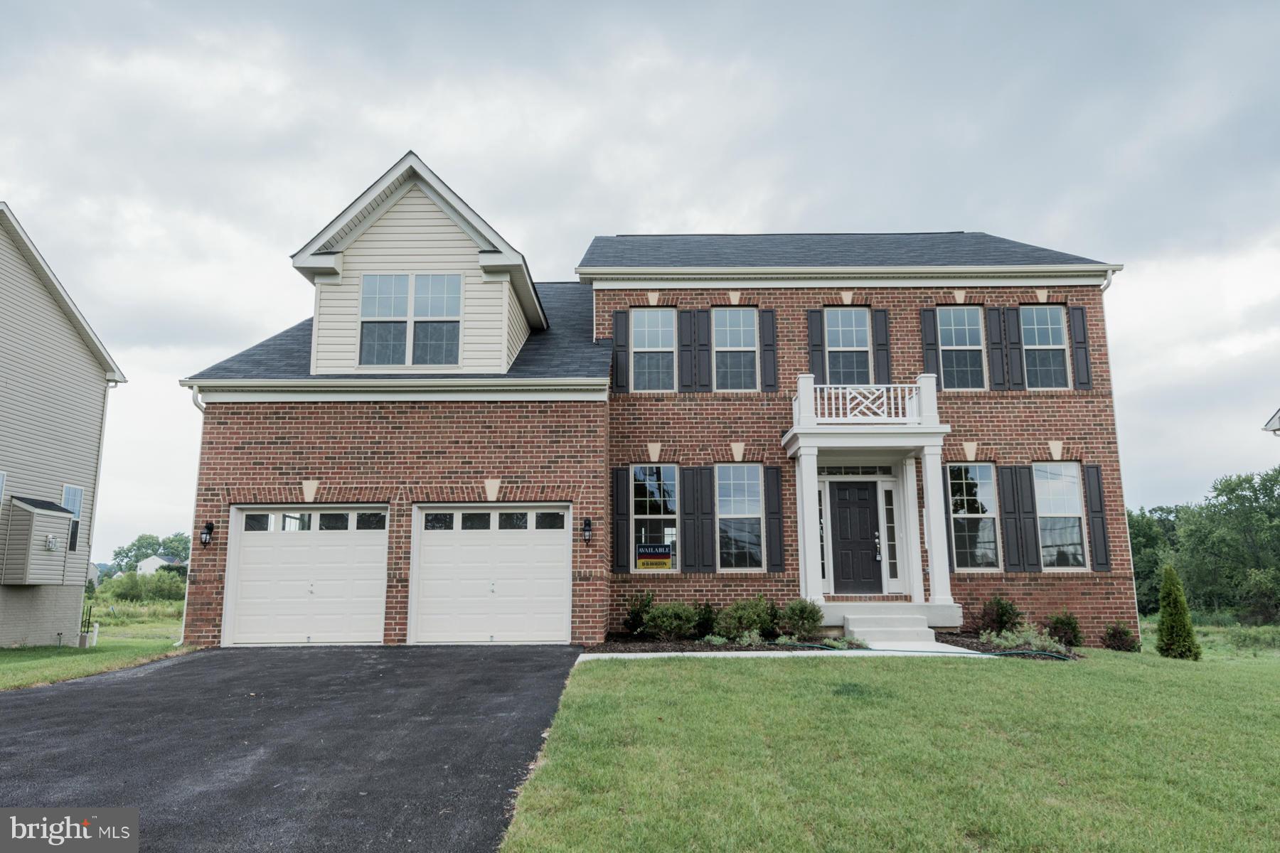 4336 Chapel Road Perry Hall, MD 21128 - Photo 1 of 30 a front view of a house with a yard and garage