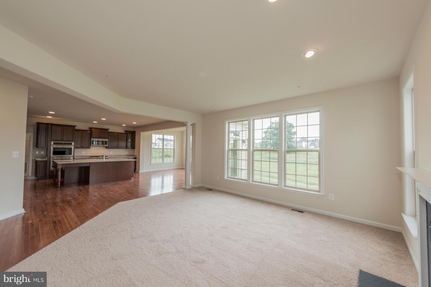 4336 Chapel Road Perry Hall, MD 21128 - Photo 11 of 30 a view of an empty room with window and kitchen view