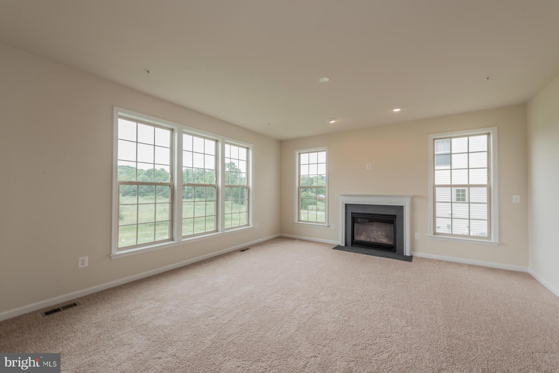 4336 Chapel Road Perry Hall, MD 21128 - Photo 13 of 30 an empty room with furniture and a fireplace