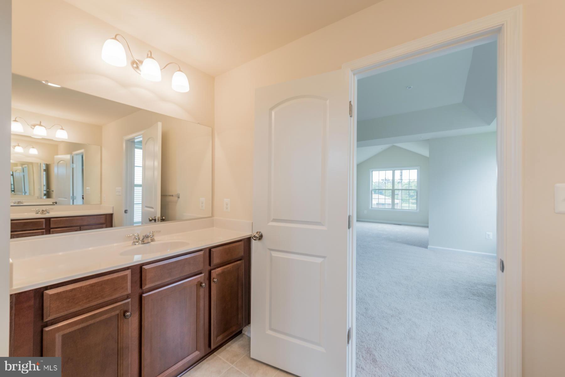 4336 Chapel Road Perry Hall, MD 21128 - Photo 23 of 30 a bathroom with a sink and a mirror