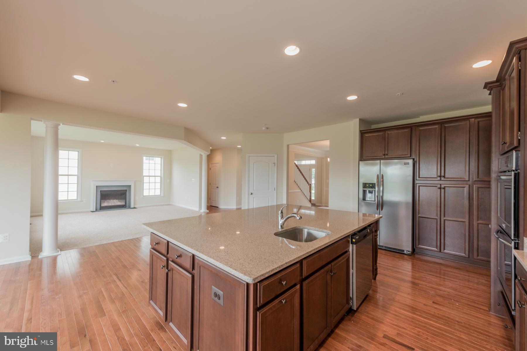 4336 Chapel Road Perry Hall, MD 21128 - Photo 7 of 30 a kitchen with a sink and refrigerator