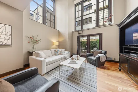 a living room with furniture fireplace and flat screen tv