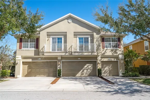 a front view of a house with garage
