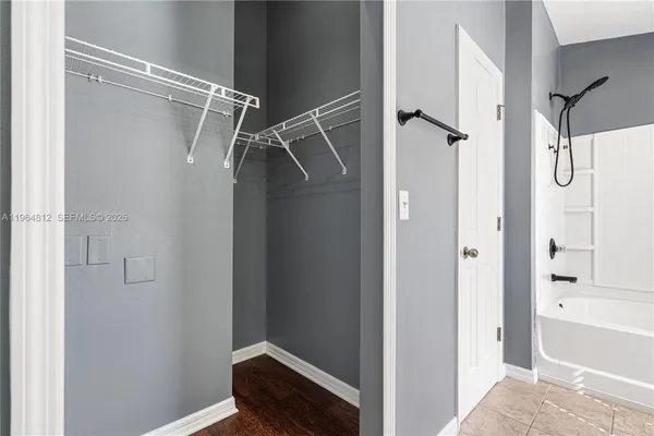 a bathroom with a glass shower door