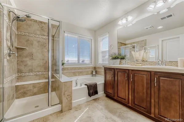 a bathroom with a granite countertop sink mirror and double