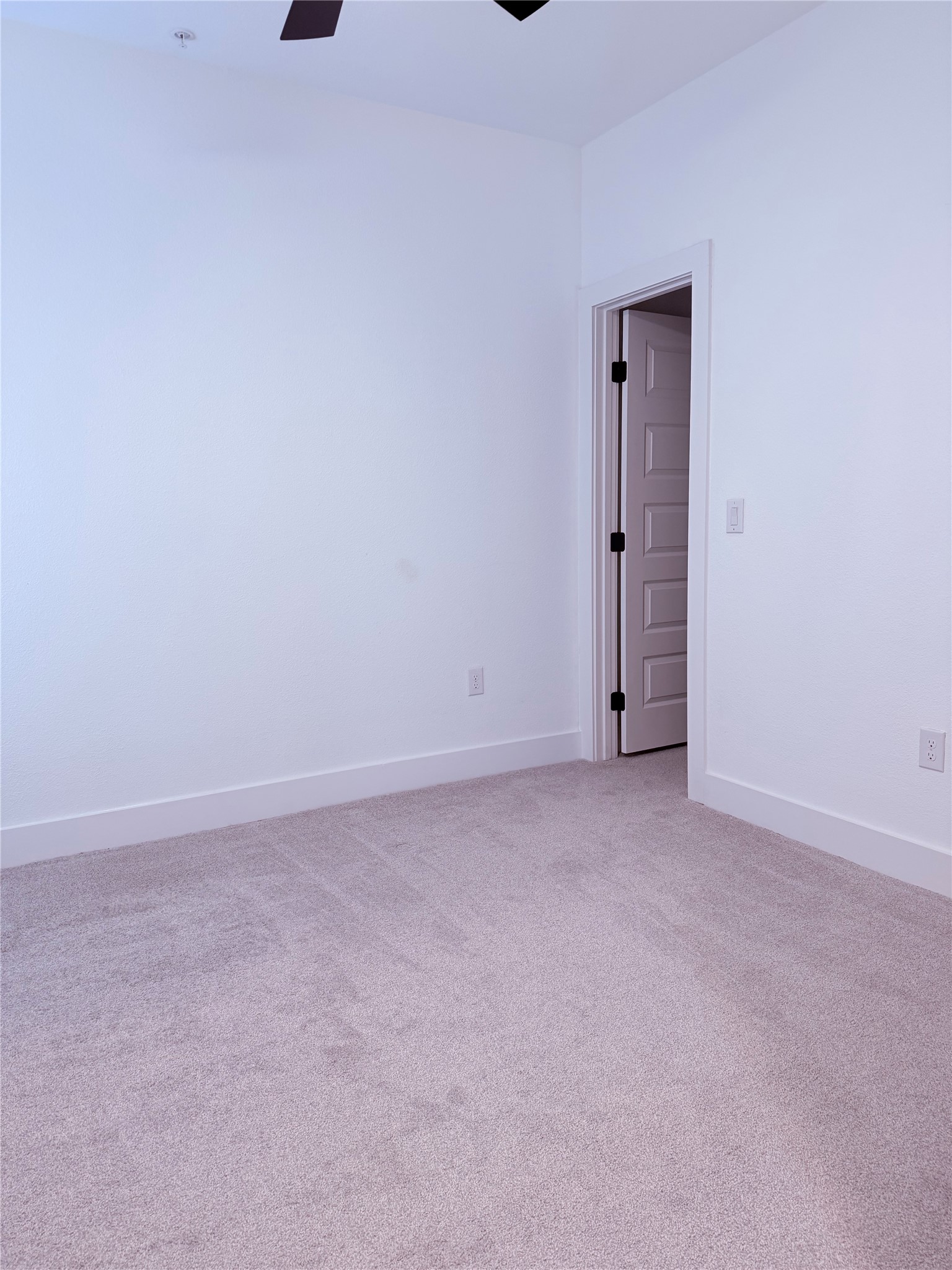 1417 Kramer Lane, Unit 7 Austin, TX 78758 - Photo 21 of 24 An inviting room, ready for personal touches, features a pristine carpeted floor and an open doorway.