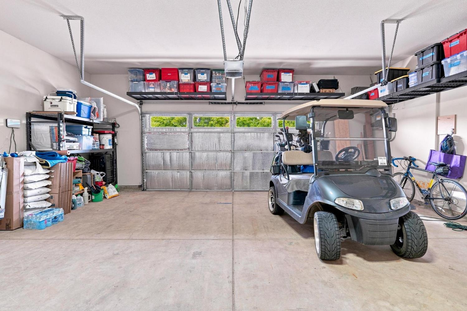 217 Rock Ridge Lane Copperopolis, CA 95228 - Photo 47 of 55 Garage - space for car, golf cart, upper storage, and workbench.