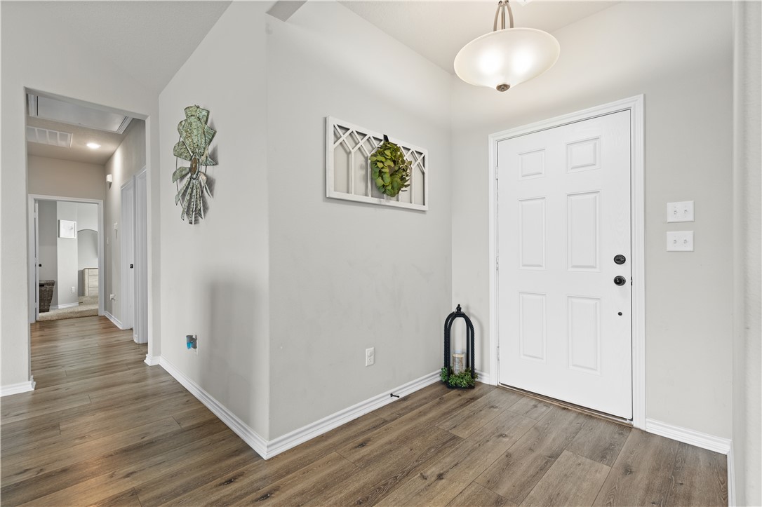 596 J W Martine Road Hearne, TX 77859 - Photo 12 of 36 a view of an empty room with wooden floor