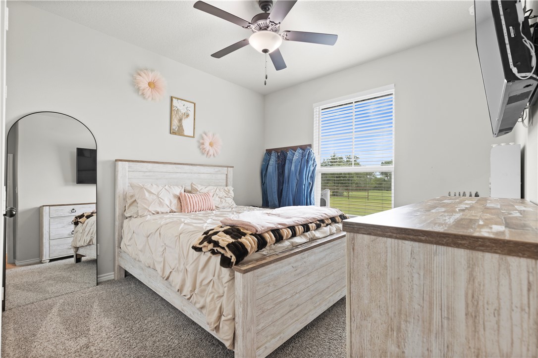 596 J W Martine Road Hearne, TX 77859 - Photo 22 of 36 a bedroom with bed and a window