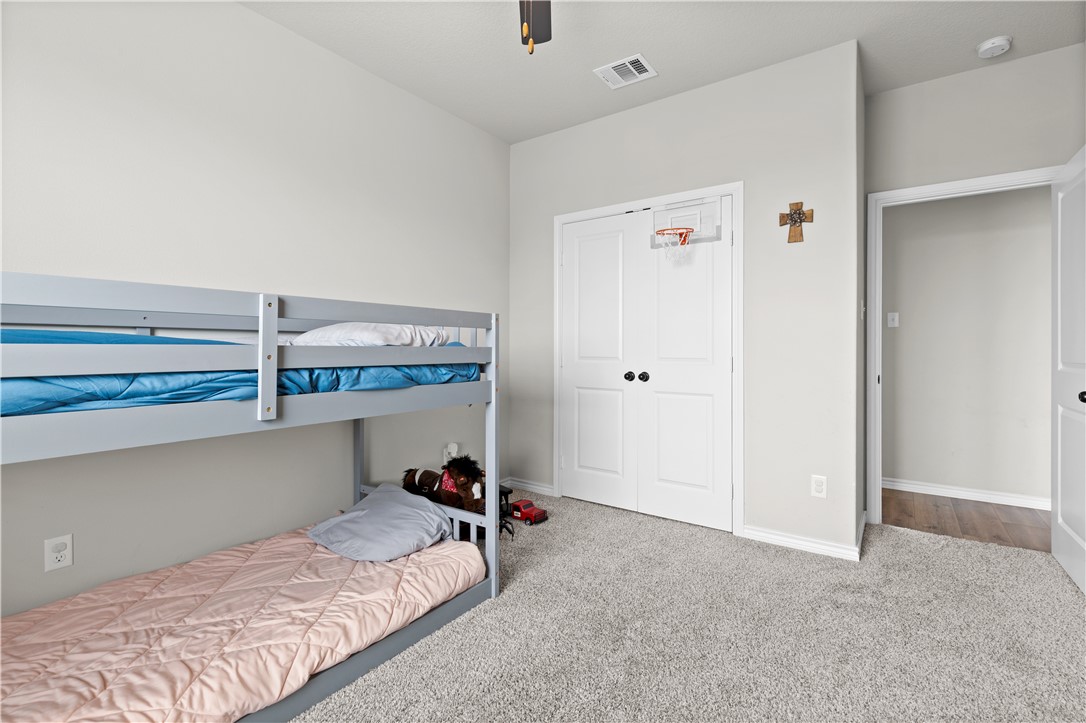 596 J W Martine Road Hearne, TX 77859 - Photo 25 of 36 a bedroom with a bed and a table