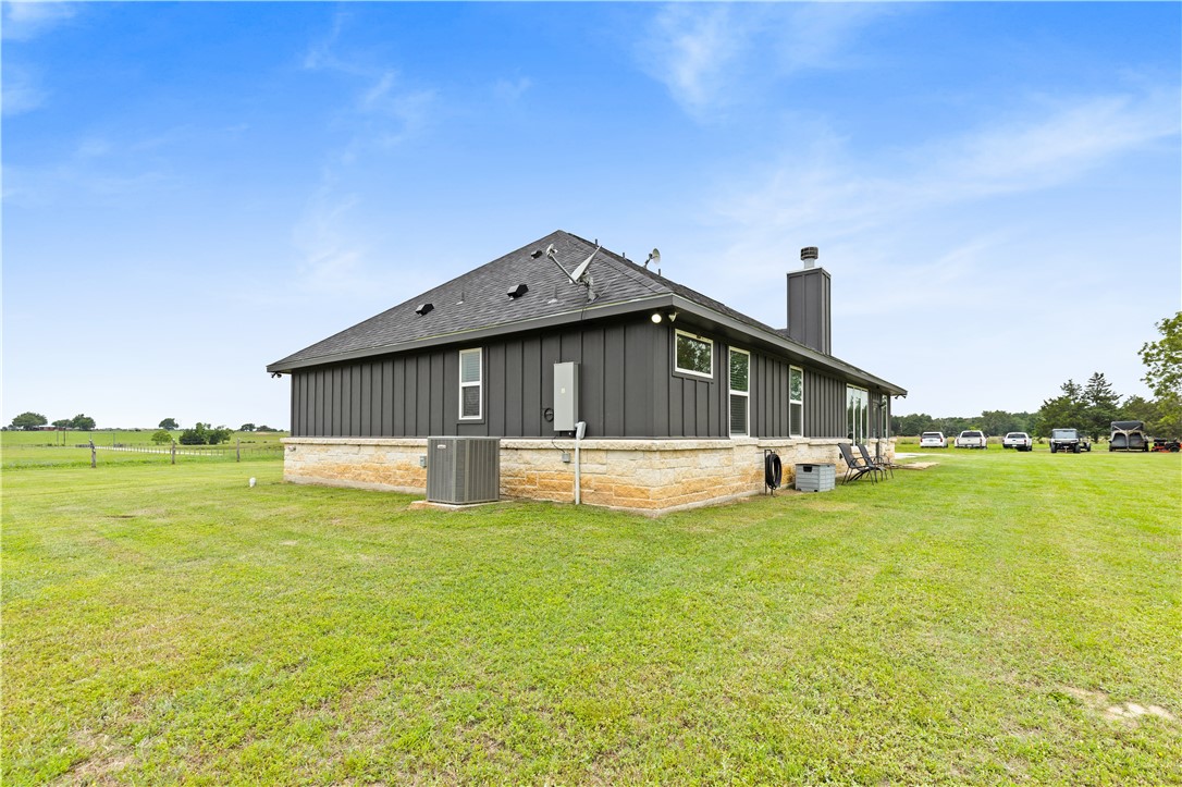 596 J W Martine Road Hearne, TX 77859 - Photo 27 of 36 a front door view of a house with swimming pool