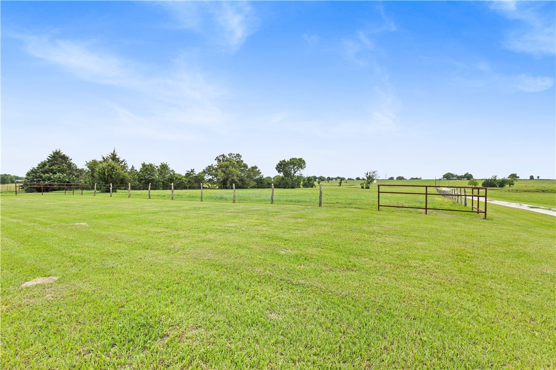 596 J W Martine Road Hearne, TX 77859 - Photo 32 of 36 a view of a green field with clear sky