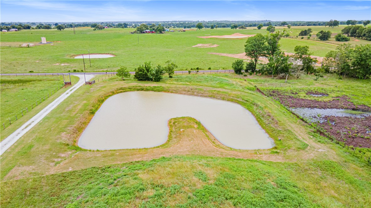 596 J W Martine Road Hearne, TX 77859 - Photo 33 of 36 a view of a lake with a swimming pool