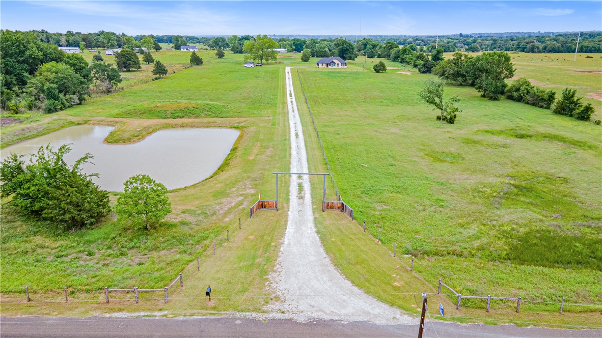 596 J W Martine Road Hearne, TX 77859 - Photo 34 of 36 a view of a swimming pool with a yard