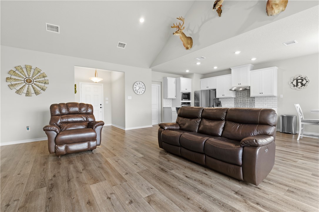 596 J W Martine Road Hearne, TX 77859 - Photo 6 of 36 a living room with furniture and a wooden floor