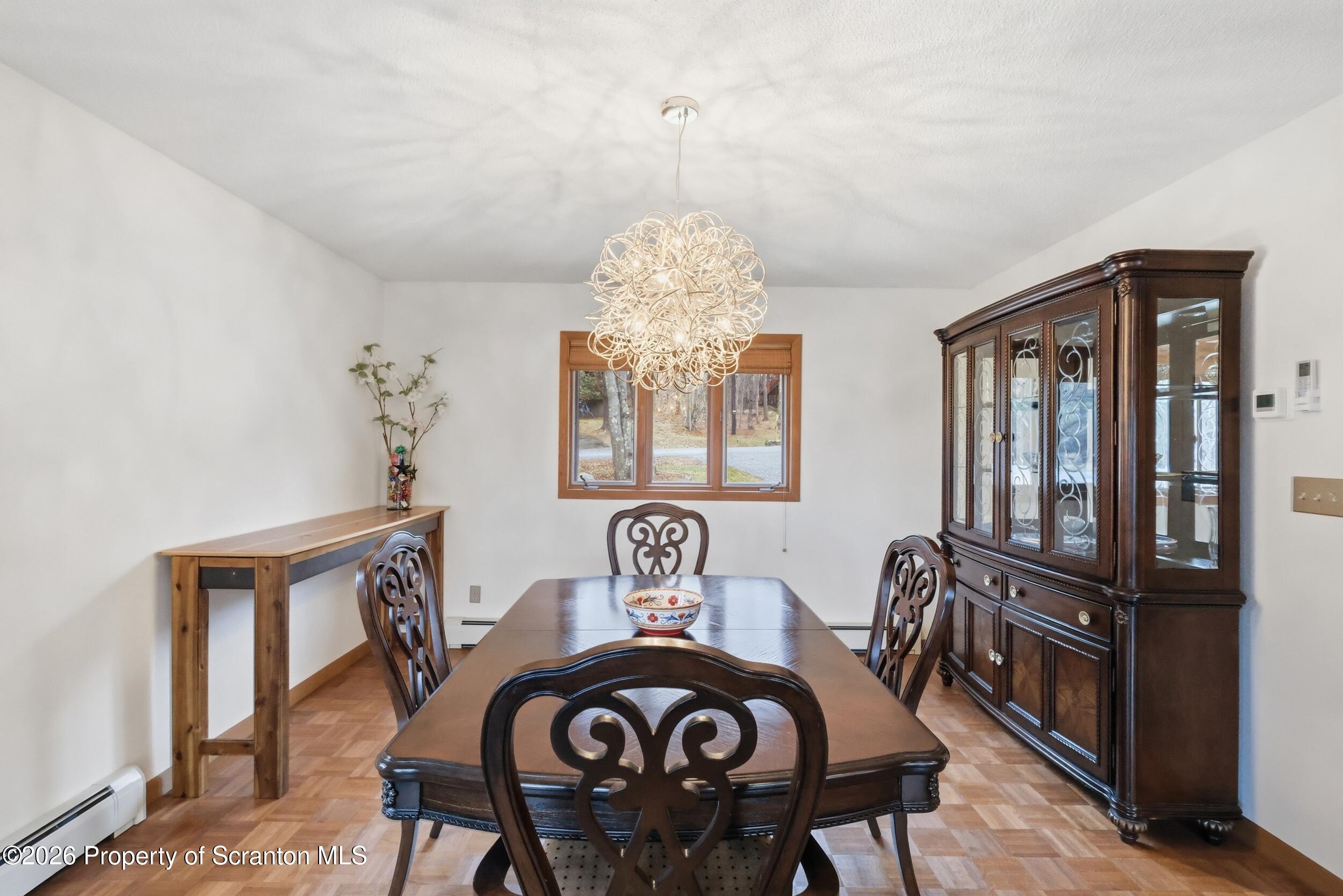 1647 Windmere Place Lake Ariel, PA 18436 - Photo 13 of 65 a view of a dining room with furniture and chandelier