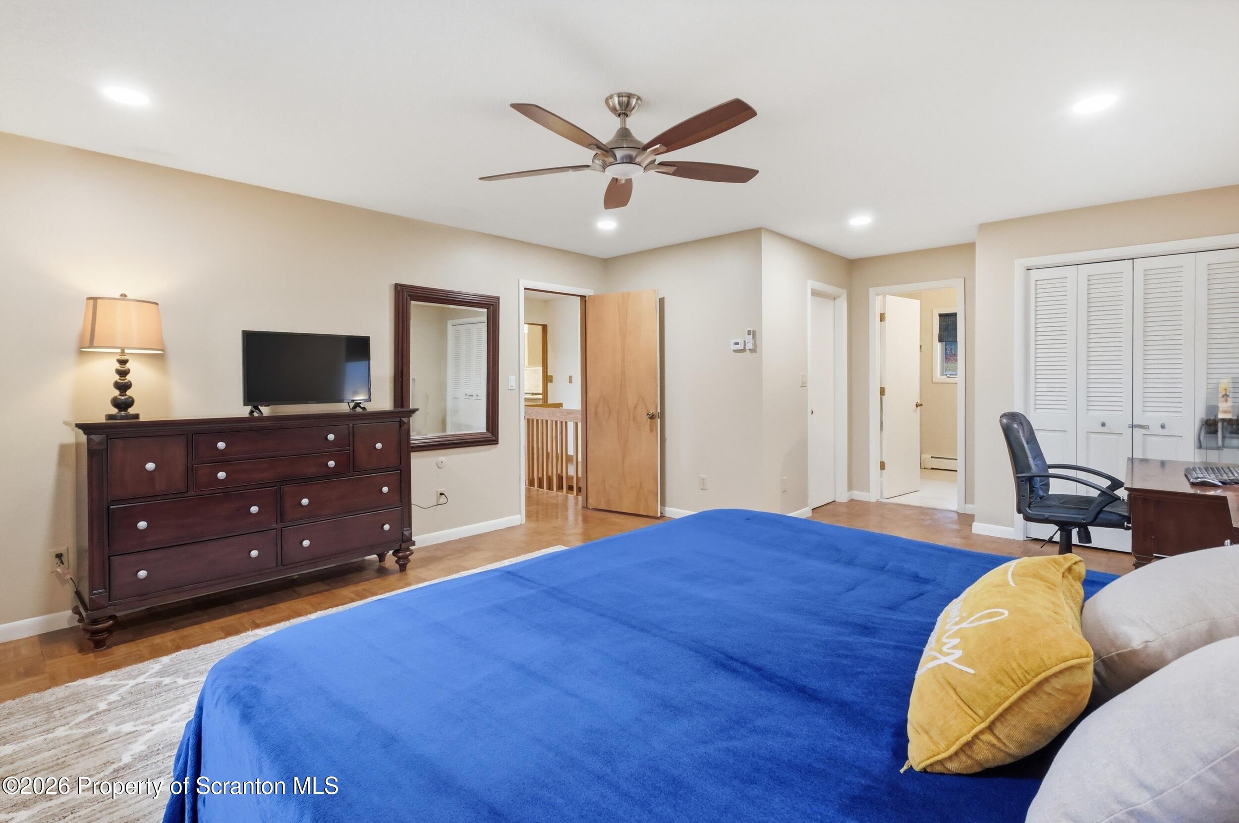 1647 Windmere Place Lake Ariel, PA 18436 - Photo 17 of 65 a bed room with a bed and a television