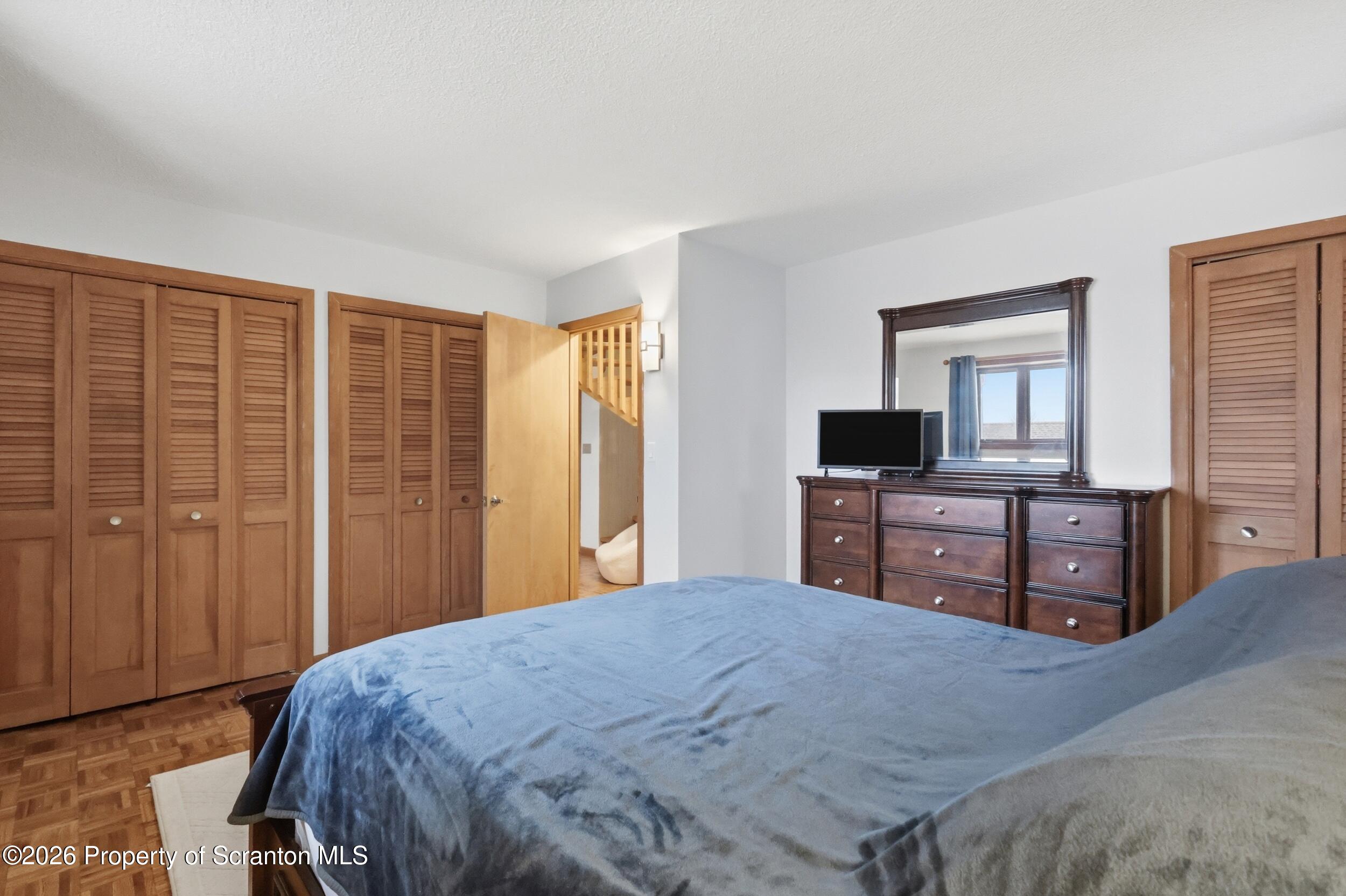1647 Windmere Place Lake Ariel, PA 18436 - Photo 20 of 65 a bedroom with a bed and a dresser