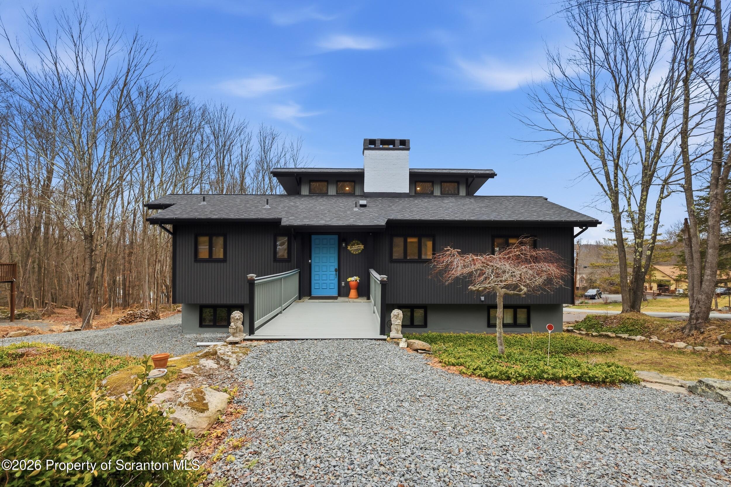 1647 Windmere Place Lake Ariel, PA 18436 - Photo 2 of 65 a front view of a house with garden