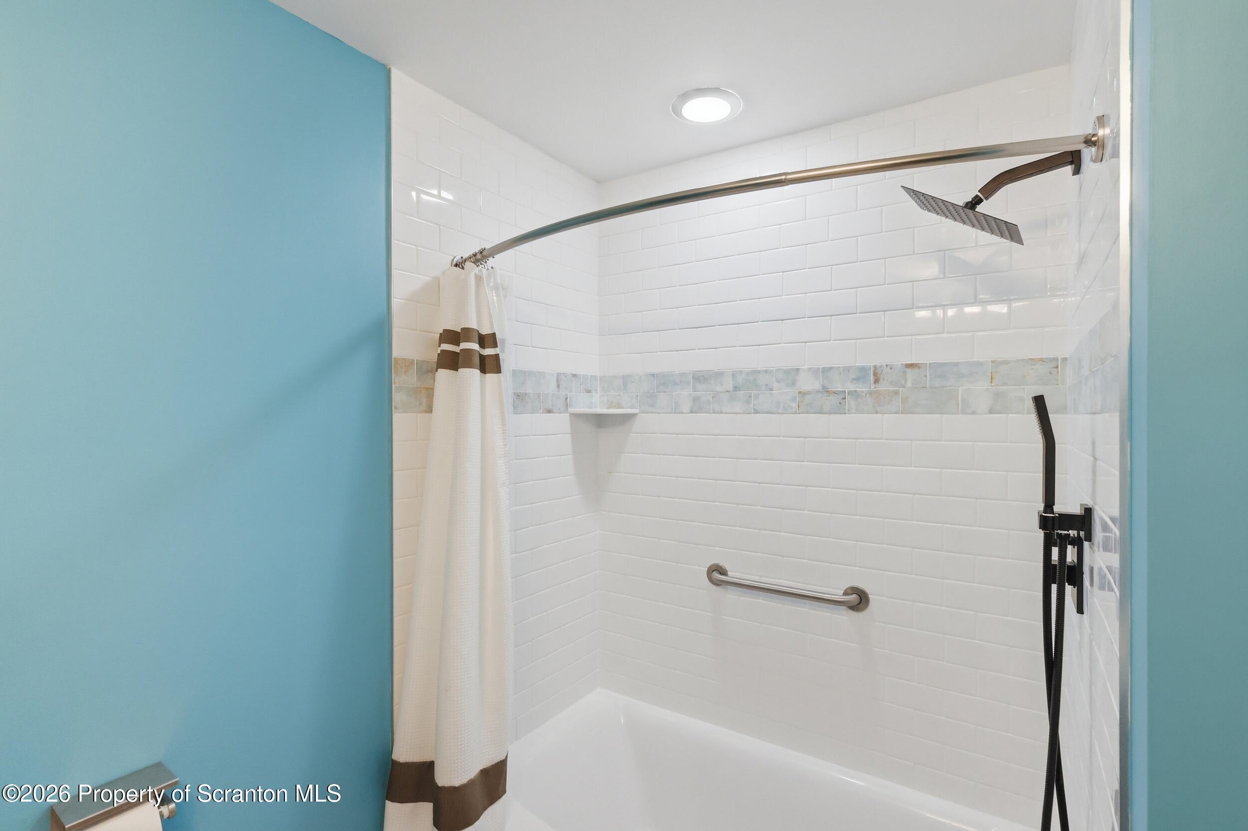 1647 Windmere Place Lake Ariel, PA 18436 - Photo 23 of 65 a bathroom with a shower and a bath tub