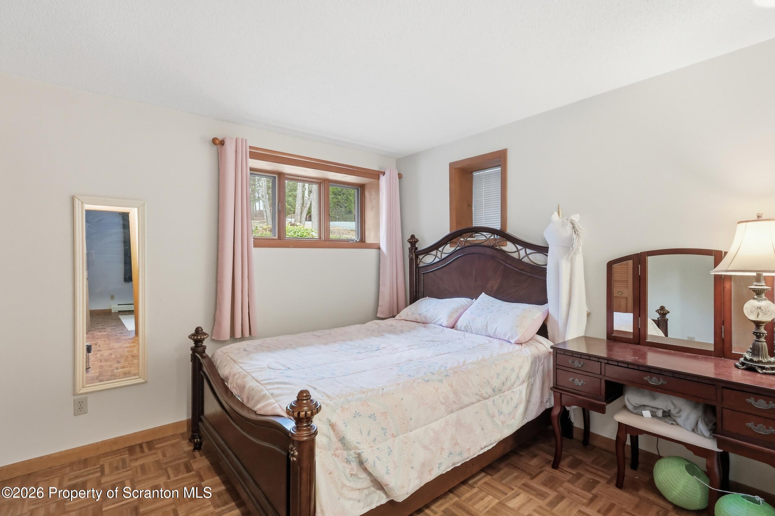 1647 Windmere Place Lake Ariel, PA 18436 - Photo 24 of 65 a bedroom with a bed and window