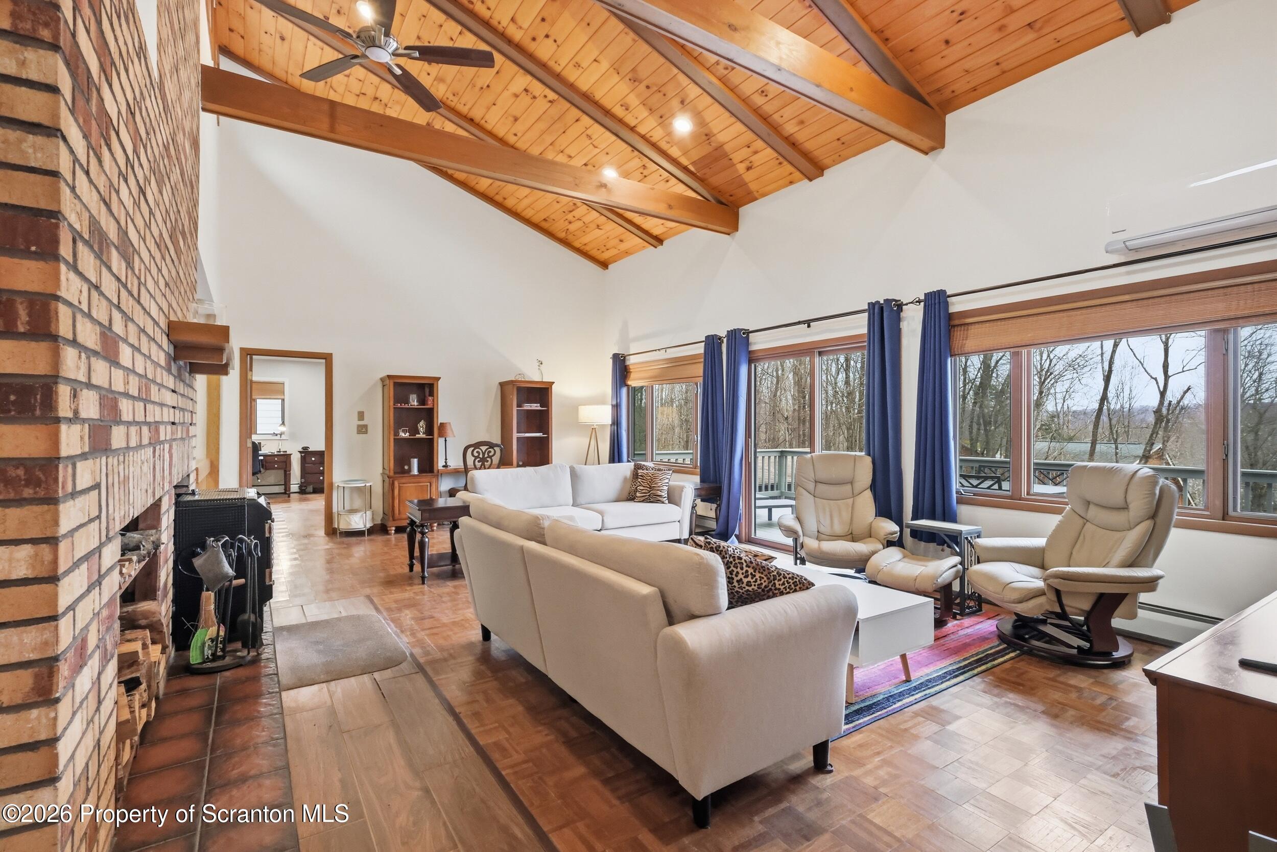1647 Windmere Place Lake Ariel, PA 18436 - Photo 4 of 65 a living room with furniture and a floor to ceiling window