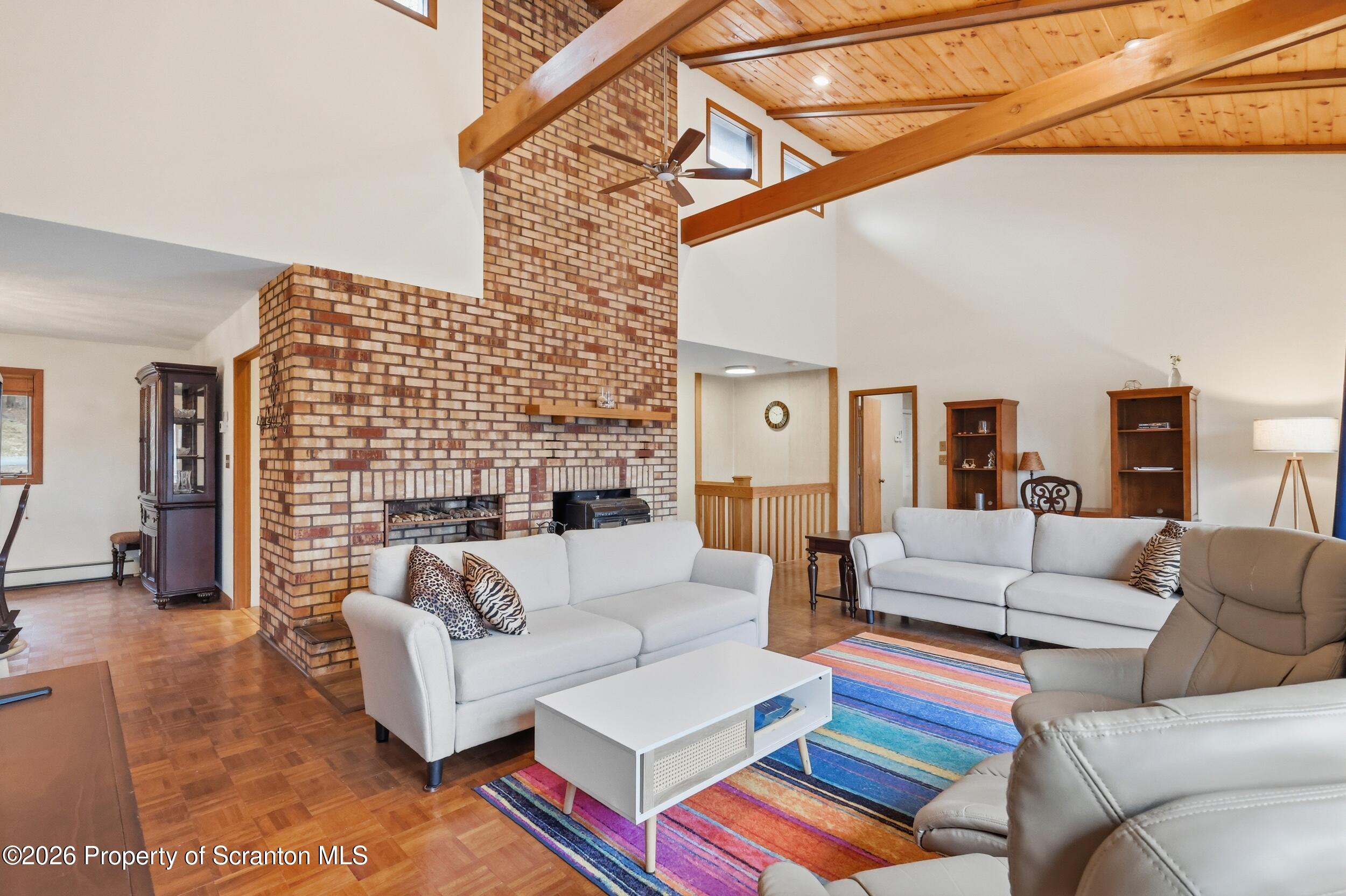 1647 Windmere Place Lake Ariel, PA 18436 - Photo 6 of 65 a living room with fireplace furniture and a rug