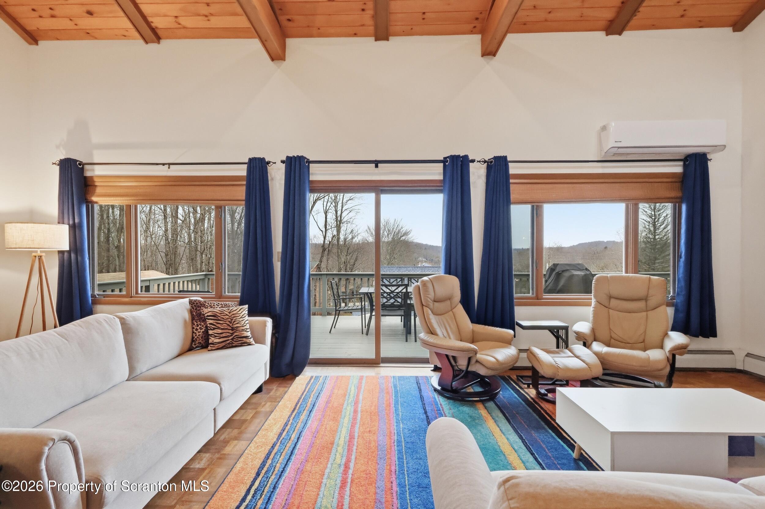 1647 Windmere Place Lake Ariel, PA 18436 - Photo 8 of 65 a living room with furniture and floor to ceiling windows
