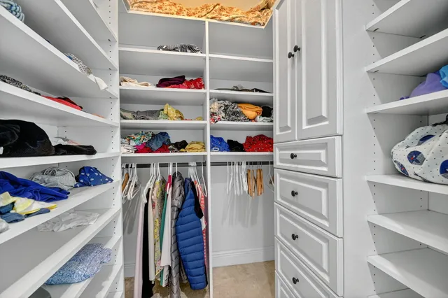 a bedroom with bed and tv