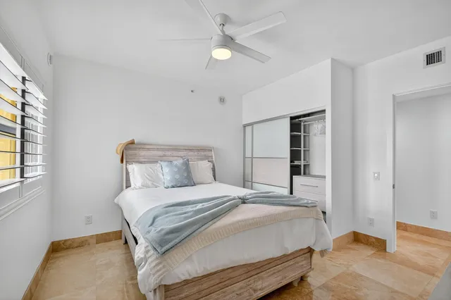 a view of a livingroom with wooden floor and a cabinet