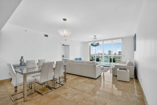 a balcony with chairs and with table