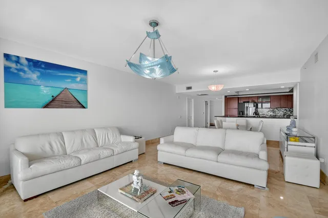 a view of a backyard with plants and palm tree