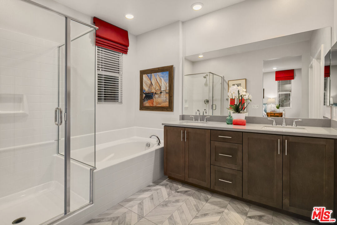 154 Tarragon Way Upland, CA 91786 - Photo 15 of 21 a bathroom with a tub sink and mirror