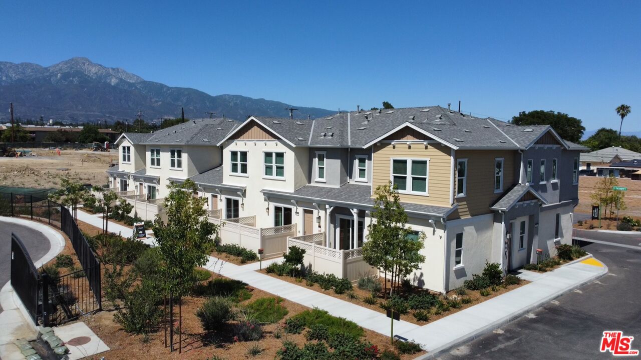 154 Tarragon Way Upland, CA 91786 - Photo 18 of 21 a front view of a house with a garden