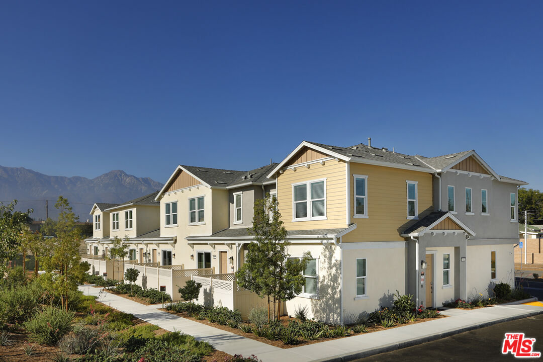 154 Tarragon Way Upland, CA 91786 - Photo 5 of 21 a front view of a house with a yard