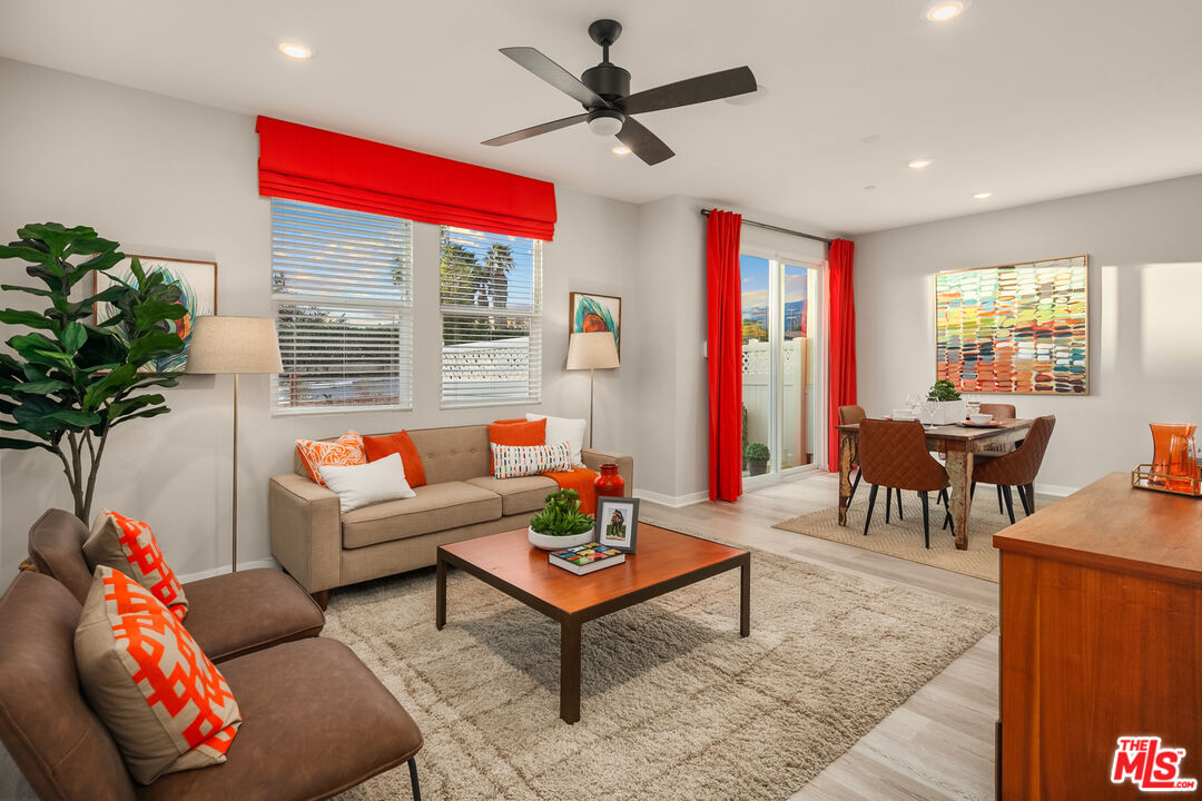 154 Tarragon Way Upland, CA 91786 - Photo 7 of 21 a living room with furniture a chandelier and a potted plant