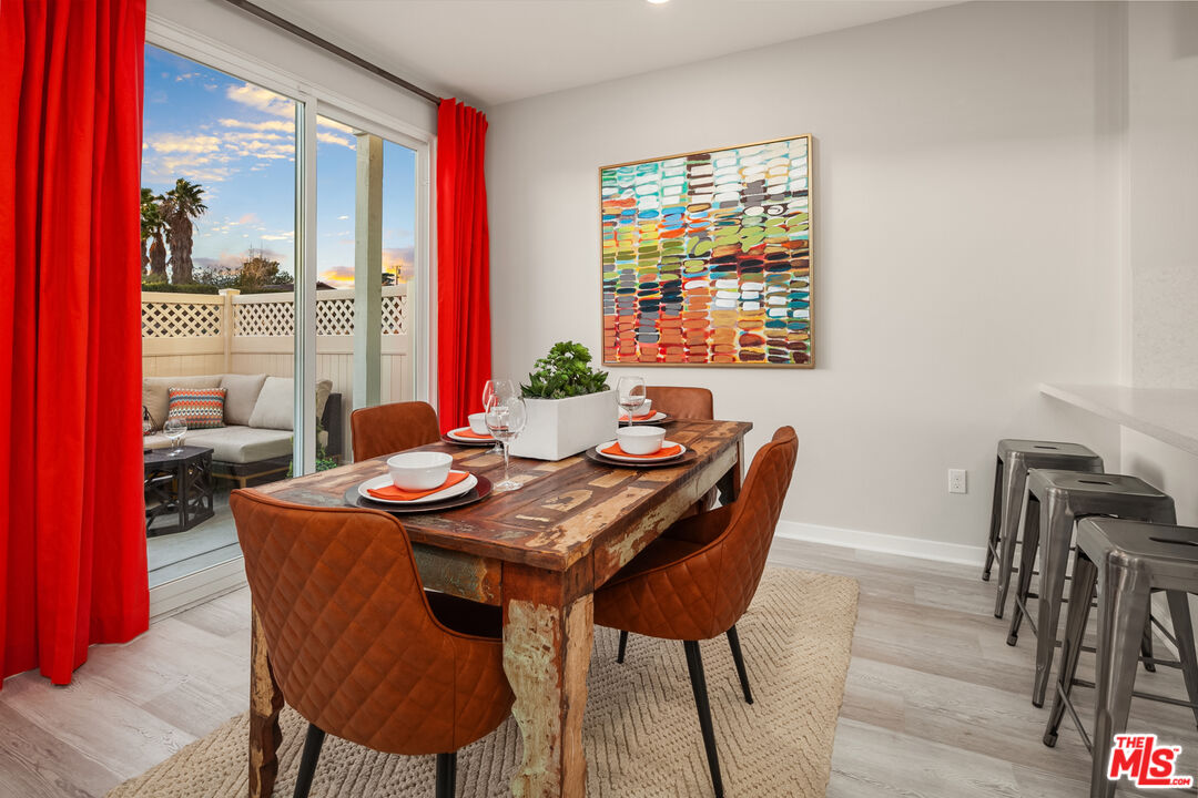 154 Tarragon Way Upland, CA 91786 - Photo 8 of 21 a dining room with furniture a rug and wooden floor
