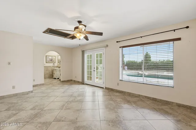 a view of an empty room with a window