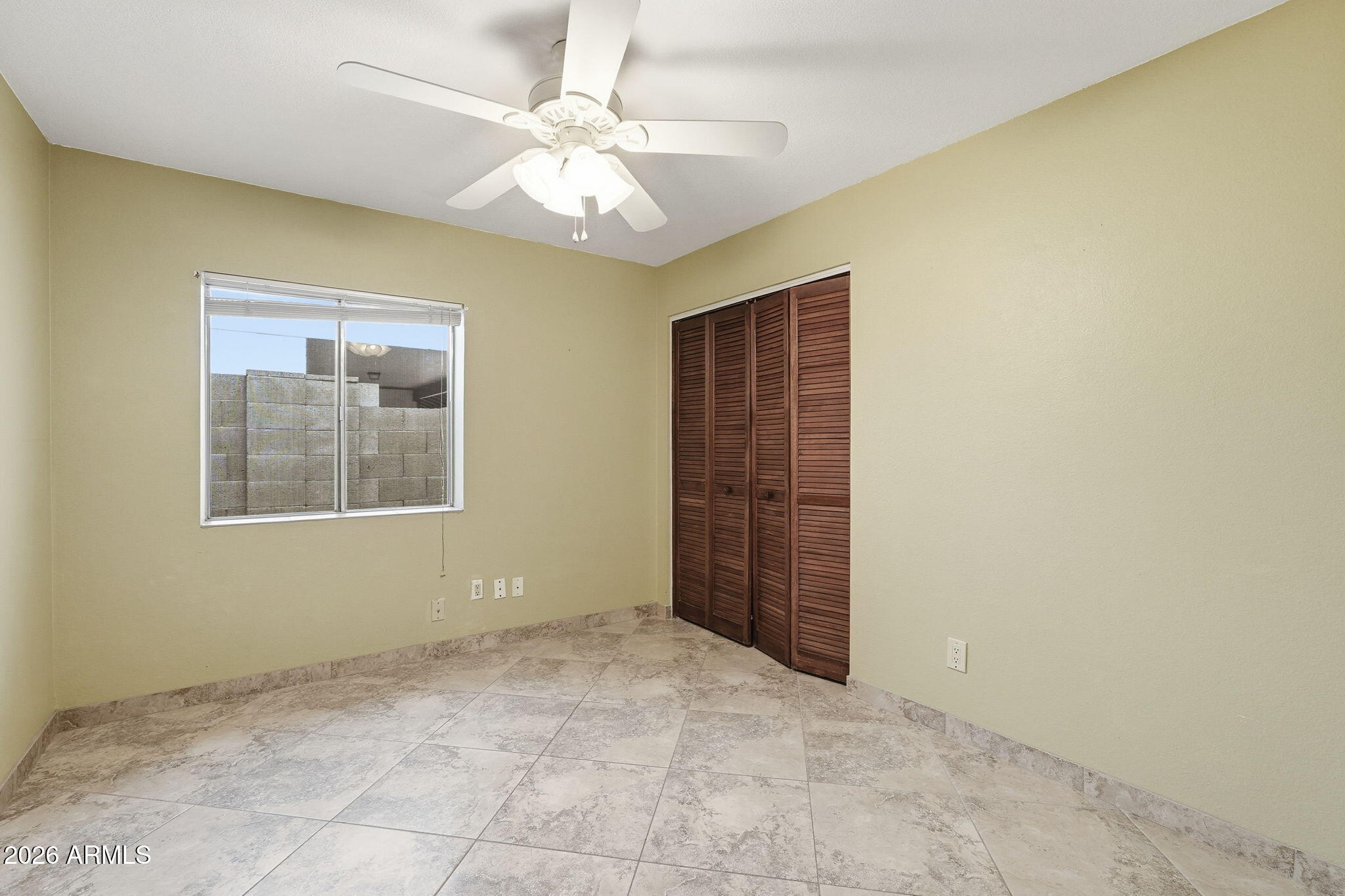 1305 North Spring Circle Mesa, AZ 85203 - Photo 17 of 28 an empty room with windows and fan