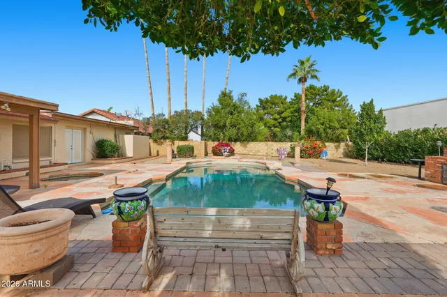 a view of a swimming pool with a patio
