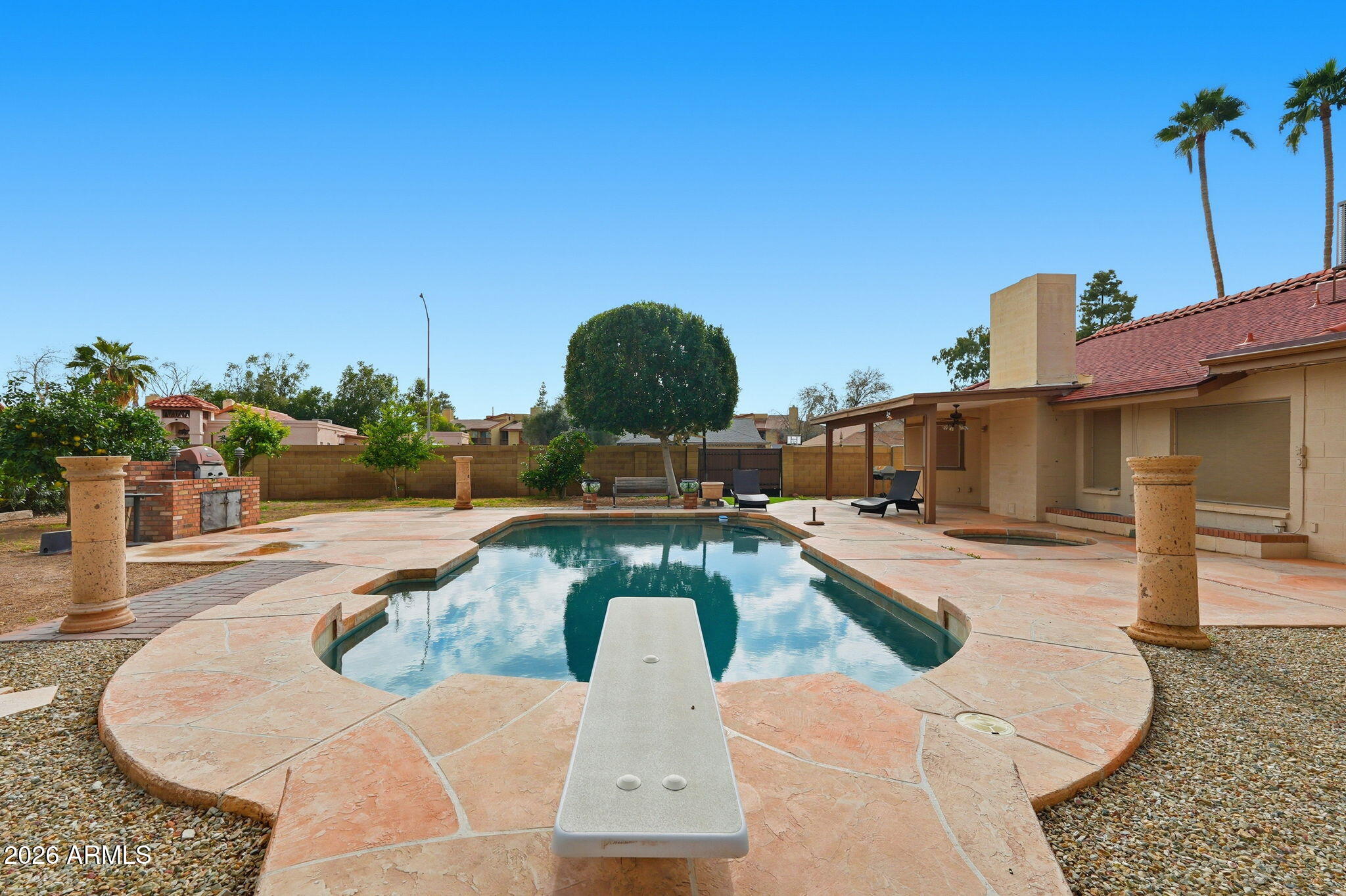 1305 North Spring Circle Mesa, AZ 85203 - Photo 26 of 28 a view of a swimming pool with a patio