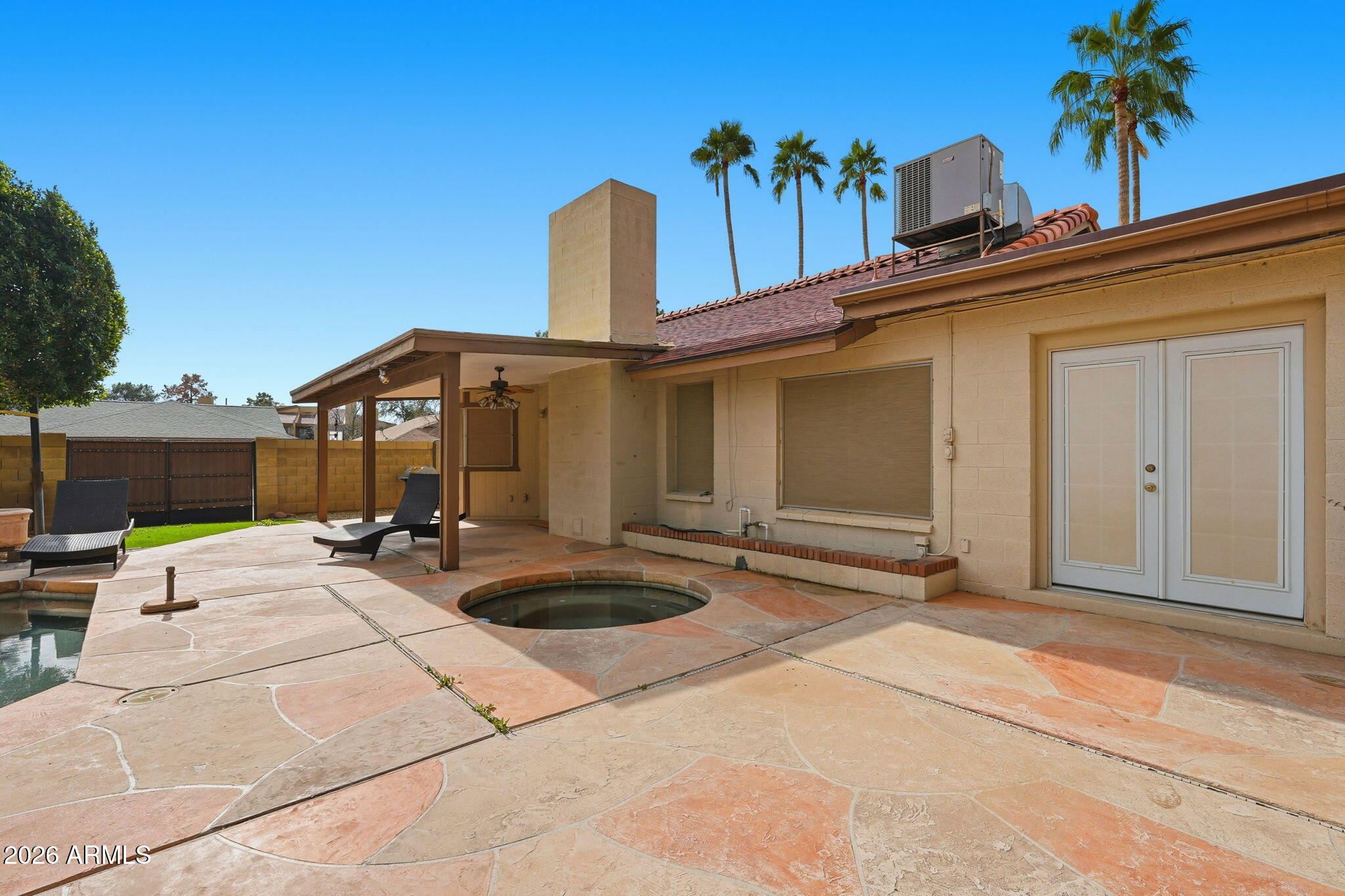 1305 North Spring Circle Mesa, AZ 85203 - Photo 27 of 28 a view of a building with sitting area