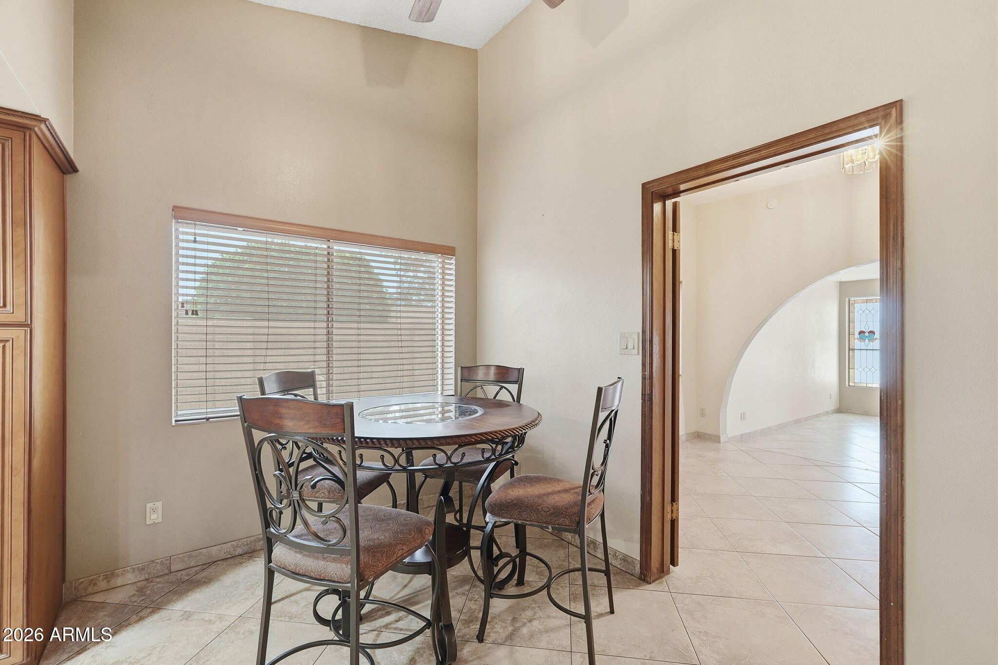 1305 North Spring Circle Mesa, AZ 85203 - Photo 6 of 28 a view of a dining room with furniture and a window