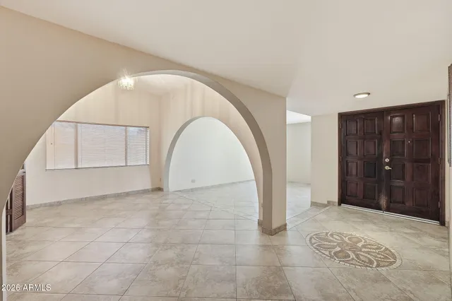 a view of an empty room with a fireplace