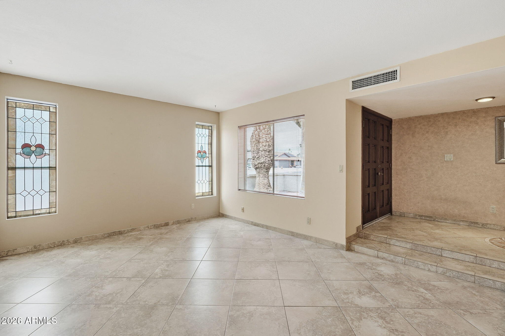 1305 North Spring Circle Mesa, AZ 85203 - Photo 10 of 28 a view of an empty room with windows