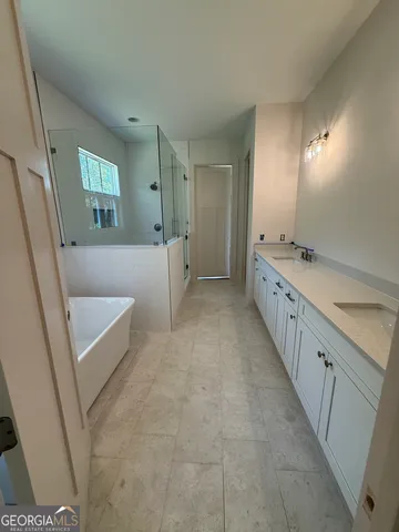 a white bath tub sitting next to a window